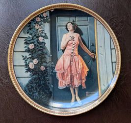This vintage porcelain plate features the "Standing in the Doorway" painting from Norman Rockwell's Rediscovered Women Collection