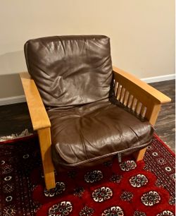 Futon chair and ottoman with leather upholstery