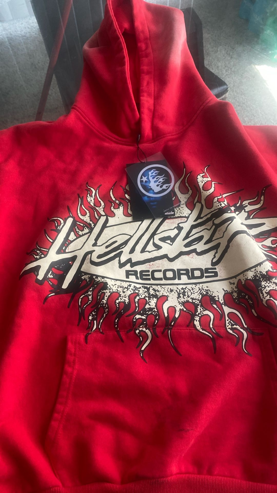 A limited red and white hellstar hoodie that is heavy cotton with a big hellstar logo on the back and it come with the bag and tag