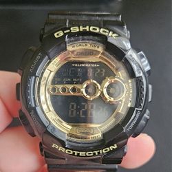 G SHOCK BLACK AND GOLD