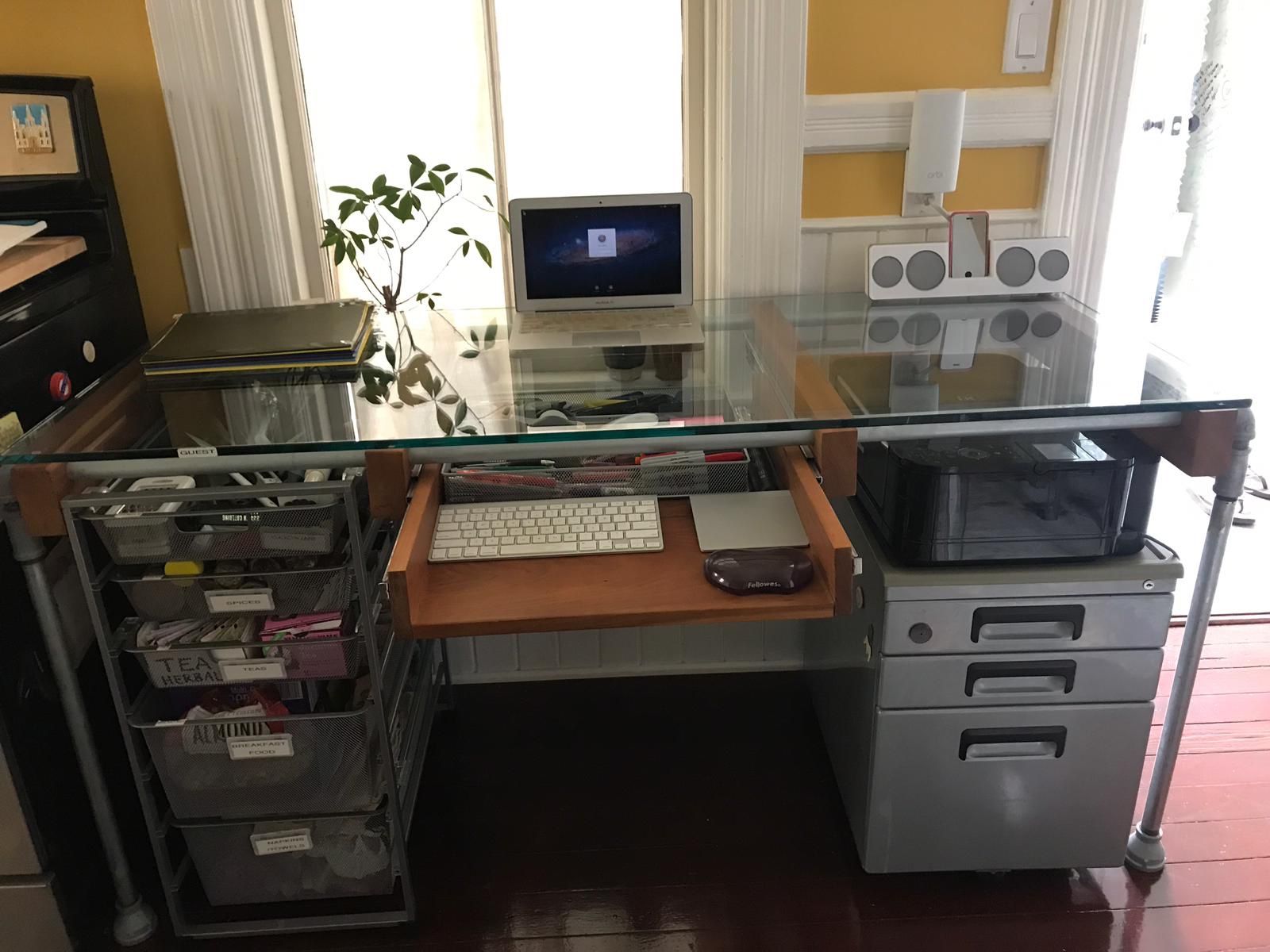 Custom built glass top desk with slide out keyboard tray