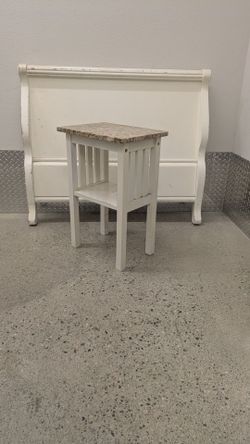 Small marbled night stand with wooden base
