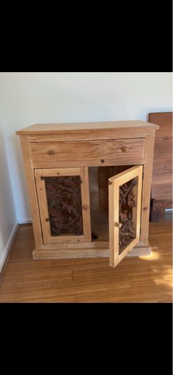 Rustic Pine Cabinet with Carved Doors