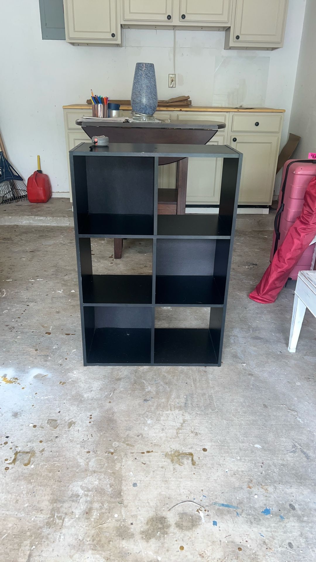 For Sale: Black Cubby Shelf – Versatile Storage!