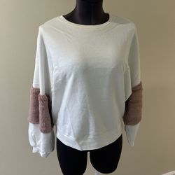 Women's White and Pink Sleeve sweatshirt, one size fits like M  Stylish women's top featuring a white body with unique pink faux fur sleeves accents. 