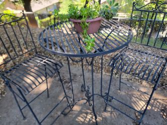 WROUGHT IRON TABLE AND CHAIRS