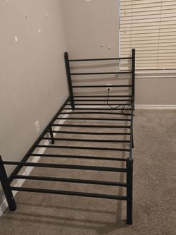Twin size metal bed frame with plug
