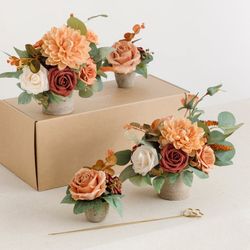 11 Ling’s Moments centerpieces in Sunset Terracotta