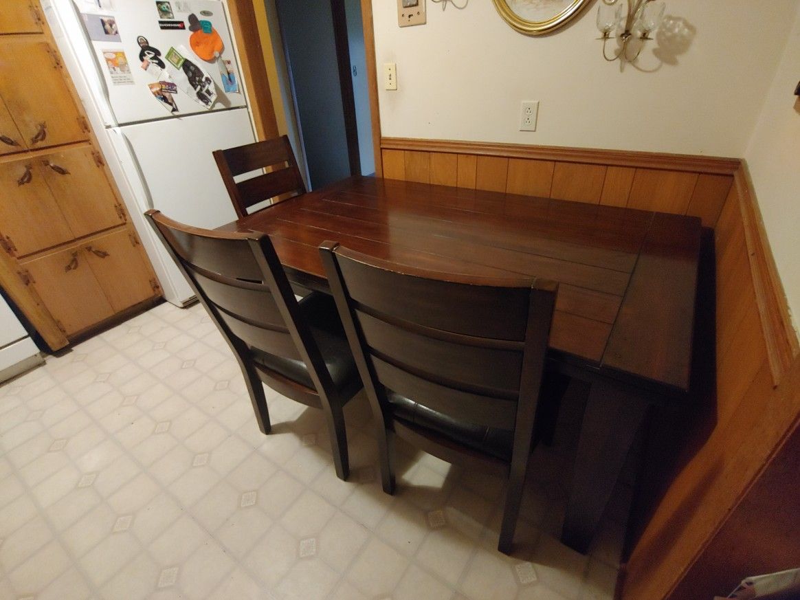 Wood Dining room table with a set of four chairs