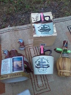 Decanter set includes wild turkey and Evan Williams and Chianti