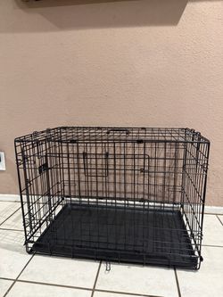 DOUBLE DOOR BLACK  WIRED CRATE FOR DOGS IN GREAT CONDITION ( H 21” x L30” x W 19”)