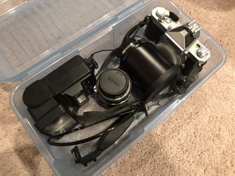 Nikomat manual camera with 4 lenses and flash