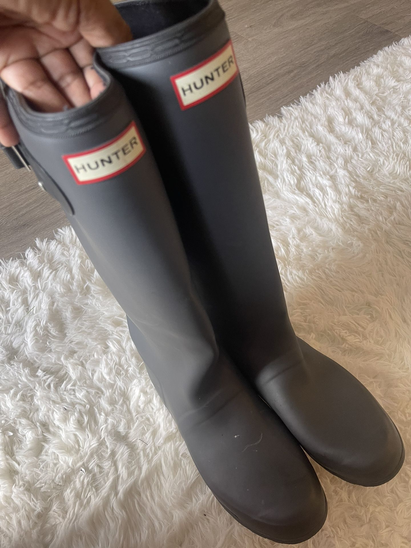 Navy blue knee-high hunter boots