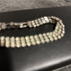 Strans Of Crystsl Beads On Simulated Silver. Never Turned Cokor But It Is Lovely But Not Real