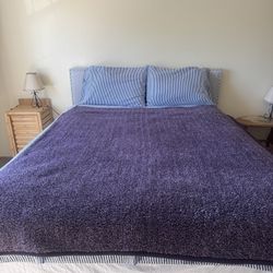 queen sized bed with headboard and foot board