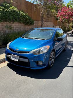 20 2014 Kia koupe sx. Miles are 152k.