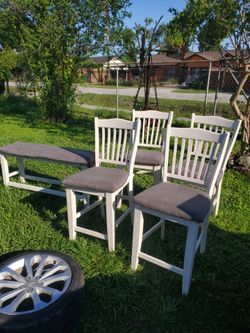 4 chairs and a bench
