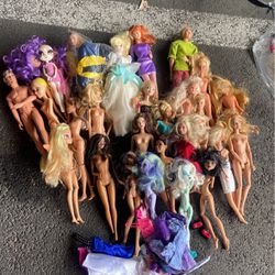 lot of barbie dolls and clothes and monster high