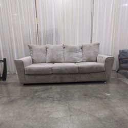 Light Beige Upholstered Three-Seat Couch
