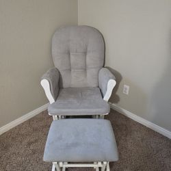 Grey And White Glinding Chair With Ottoman.