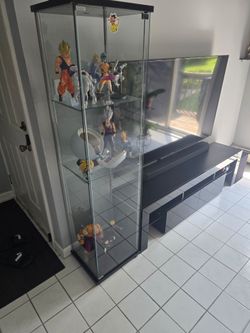 Dragon ball figures and glass display