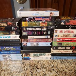 32 VHS Tapes With Rewinder.$30.00