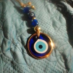 9 1/2 AND AND THE EVIL EYE WALL HANGING FOR GOOD LUCK AND WILL EXTRA BEADS GOLD TRIM WHERE ONE OF A KIND
