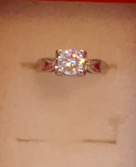 Is A 1 Carat Moissanite Diamond Ring Set In Sterling Silver That Is Adjustable It Is Brand New I Have A Diamond Tester To Show You It Will Test Positi