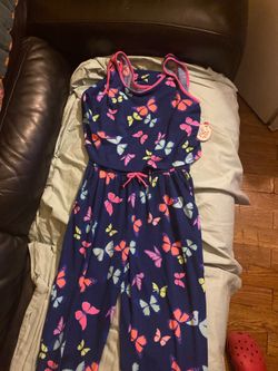 Brand new one piece blue with bright butterflies