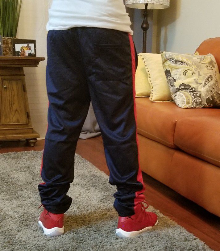 Navy blue and red track pants