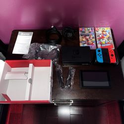 Nintendo Switch Console (Red/Blue Joy-Con) + 2 Games – Excellent Condition (comes with everything)