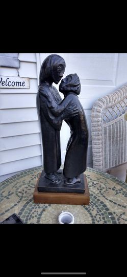 Statue On Wood Platform 