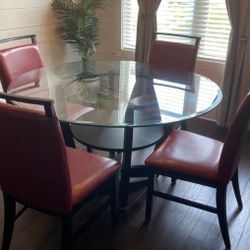 Ashley Furniture - Glass dining table + 4  chairs
