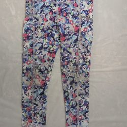 Fabletics mid-rise leggings in a multicolor abstract paint pattern. Size 4 girls