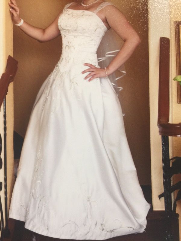 Wedding dress with removable train and pockets.