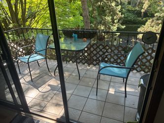 Patio glass table and 2 chairs