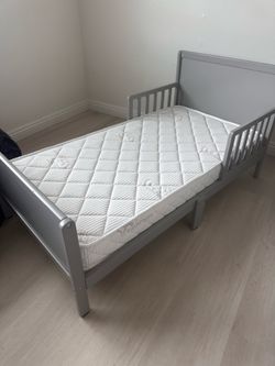 Toddler Bed frame with new mattress