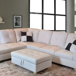 New White Leather Sectional And Ottoman 