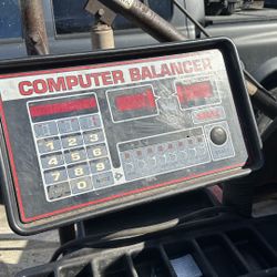 Tire Balancer And Rim Clamp