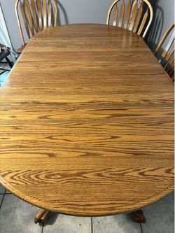 Wooden dining room table with 8 chairs