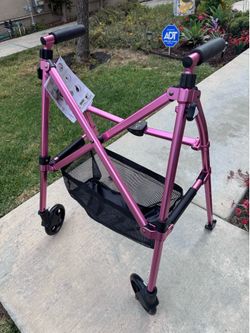Light Weight Folding Walker- pink color, weight limit 400 lbs. brand new