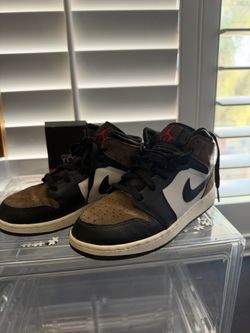 Brown and black high tops Nikes size 5.5y