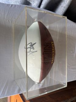 Signed football by Carson Palmer and teammate
