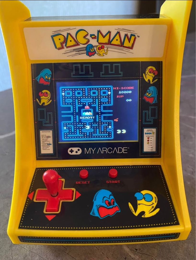 Pac-Man arcade machine by My Arcade. Approx size 7 inches high by 5 inches wide.