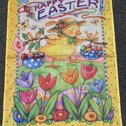New (no tags) Mary Engelbreit Happy Easter large 28” x 40” garden flag features a yellow chick in a straw hat carrying Easter egg baskets through a fi