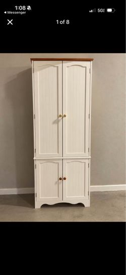 2 white cabinets (one has broken leg in back)
