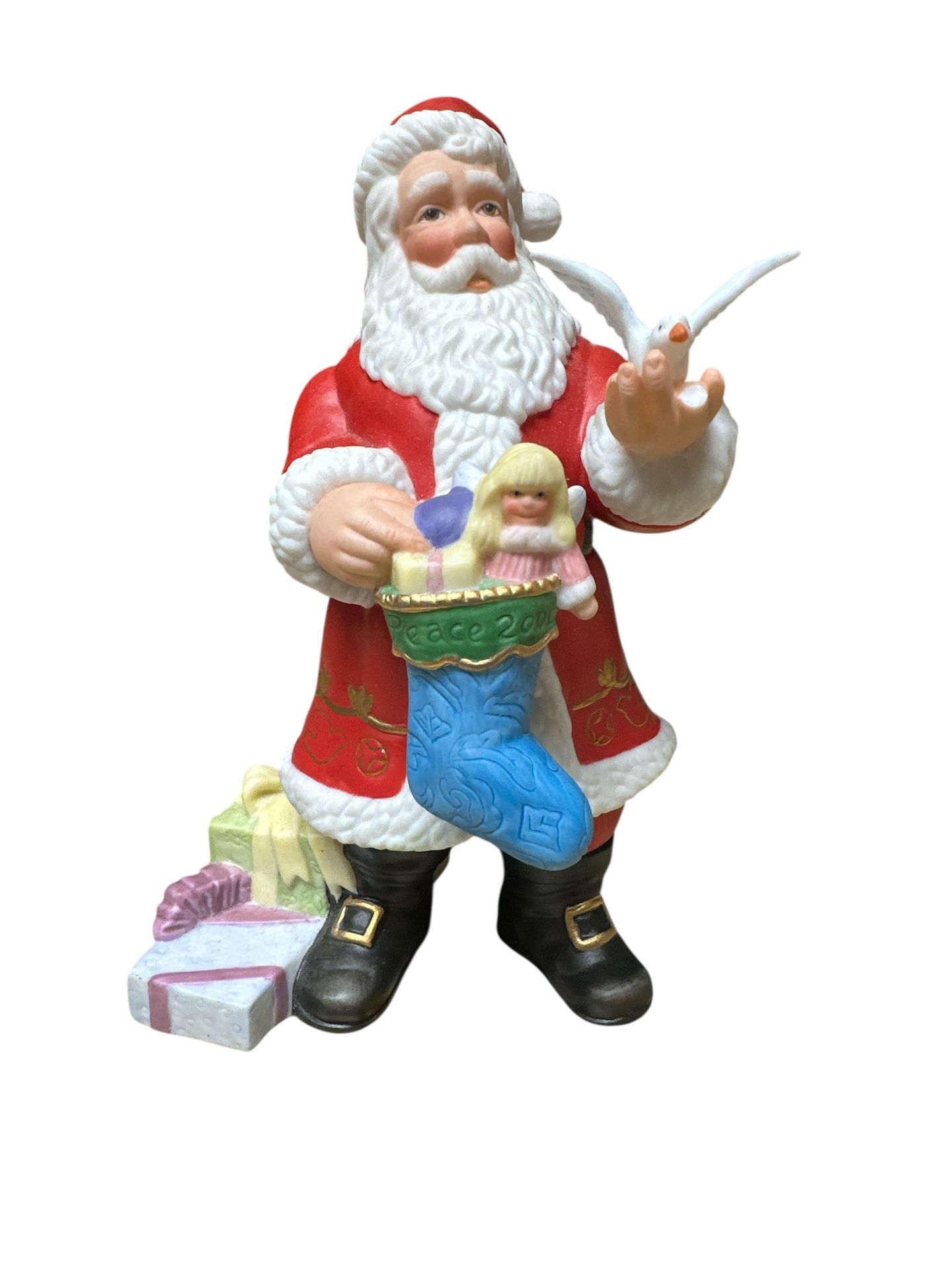 The Lenox Limited Edition 2000 Annual Santa Christmas Figurine is crafted of hand painted fine porcelain, accented with 24 karat gold. This is from t