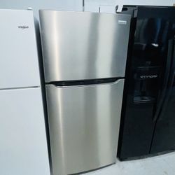Frigidaire stainless steel refrigerator (30" x 67" x 29) — includes a receipt for a 90-day warranty.