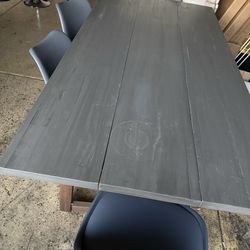 Solid wood Dining Table with 4 chairs faux leather padding, and wood legs