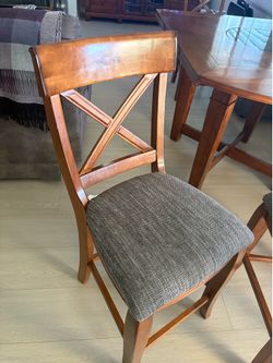 Dinner table and chairs   Brown table with gray marble center